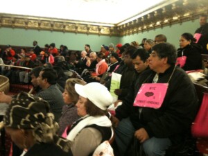 Supporters from the Street Vendor Project and Vamos Unidos watch from the City Council chamber's balcony