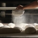 several roles being sprinkled with powder