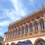 Ornate features and stained glass windows of the back of the Ca' d'Zan mansion at the Ringling Estate