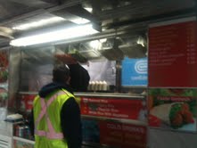 Relief worker ordering at Adel's #1 Halal in the Financial District