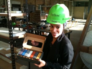 IceStone Marketing Director Sarah Corey shows off samples of the company's product.
