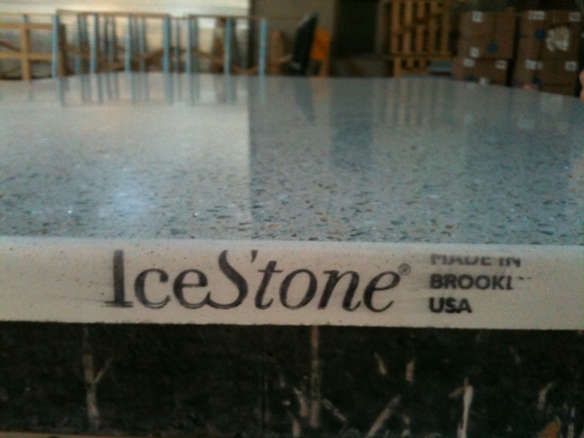Photo of an IceStone countertop with the company logo along the edge of the slab.