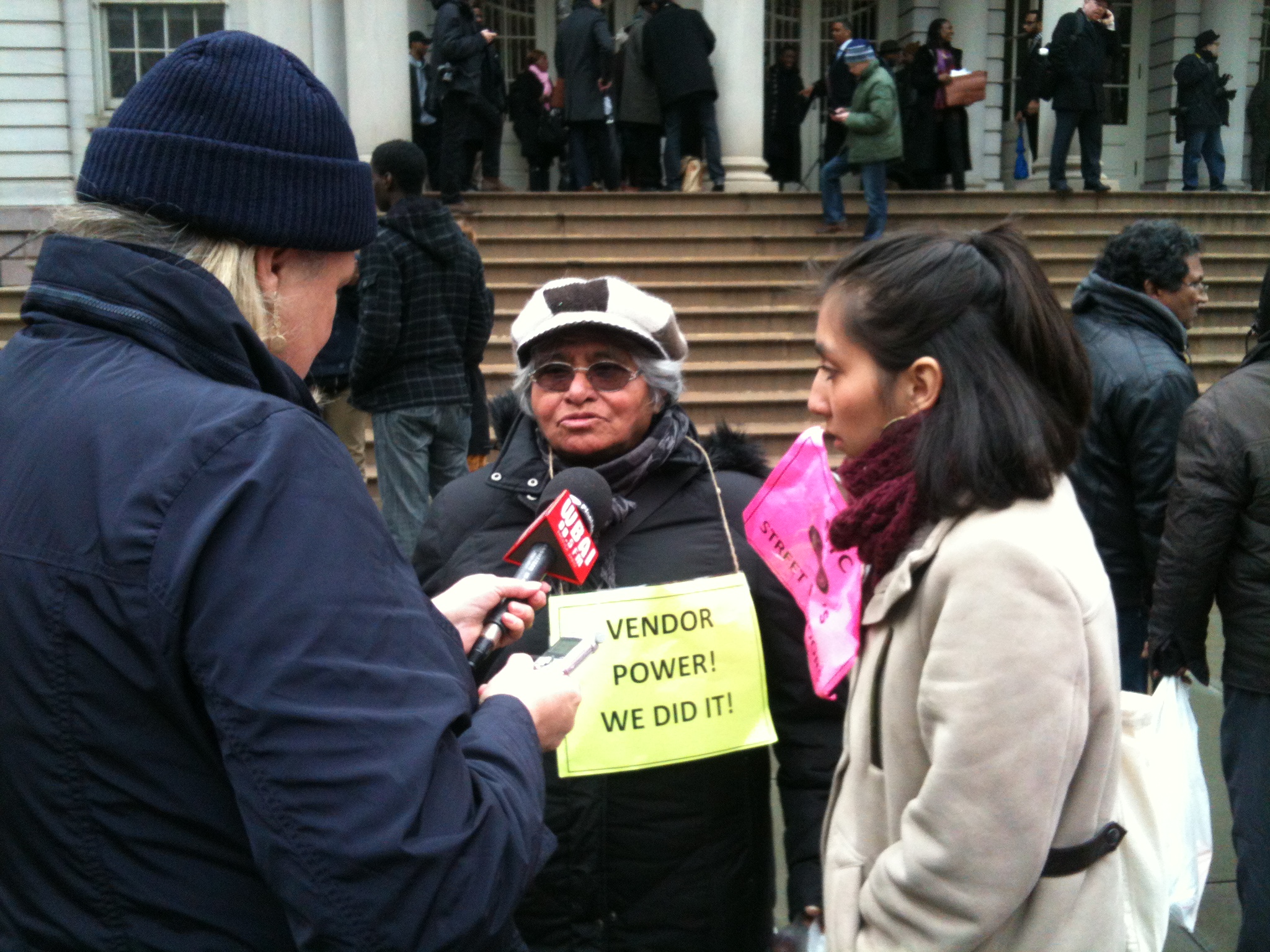 SVP board member Helodora Vivar-Flores interviewed on the steps of City Hall
