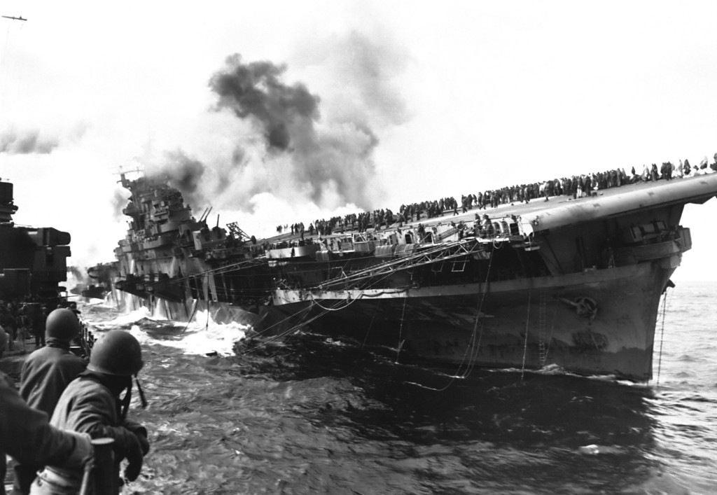 USS Franklin as seen from USS Santa Fe after being struck by a Japanese bomb, March 19, 1945.