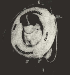 Salty Sam wearing a life ring from USS Wrangell at a ceremony at the Brooklyn Navy Yard, 1956. Credit: Brooklyn Navy Yard Archive.