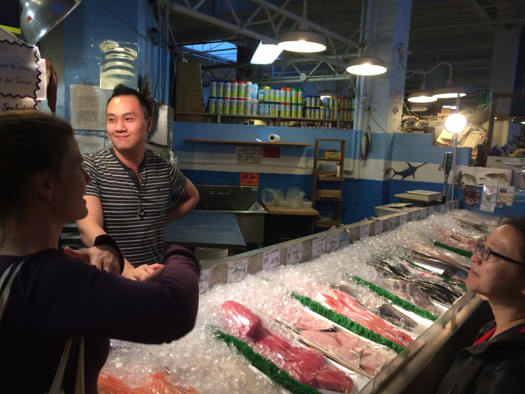 Eric working behind the counter at New Star Fish Market.