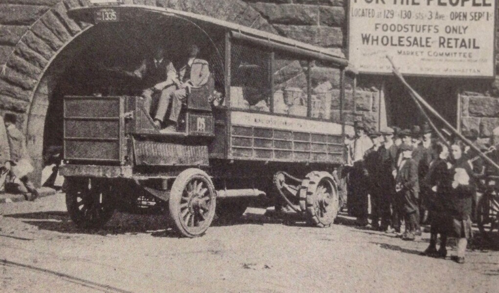 A mail truck transformed into a market wagon carrying food