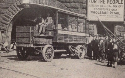 A mail truck transformed into a market wagon carrying food