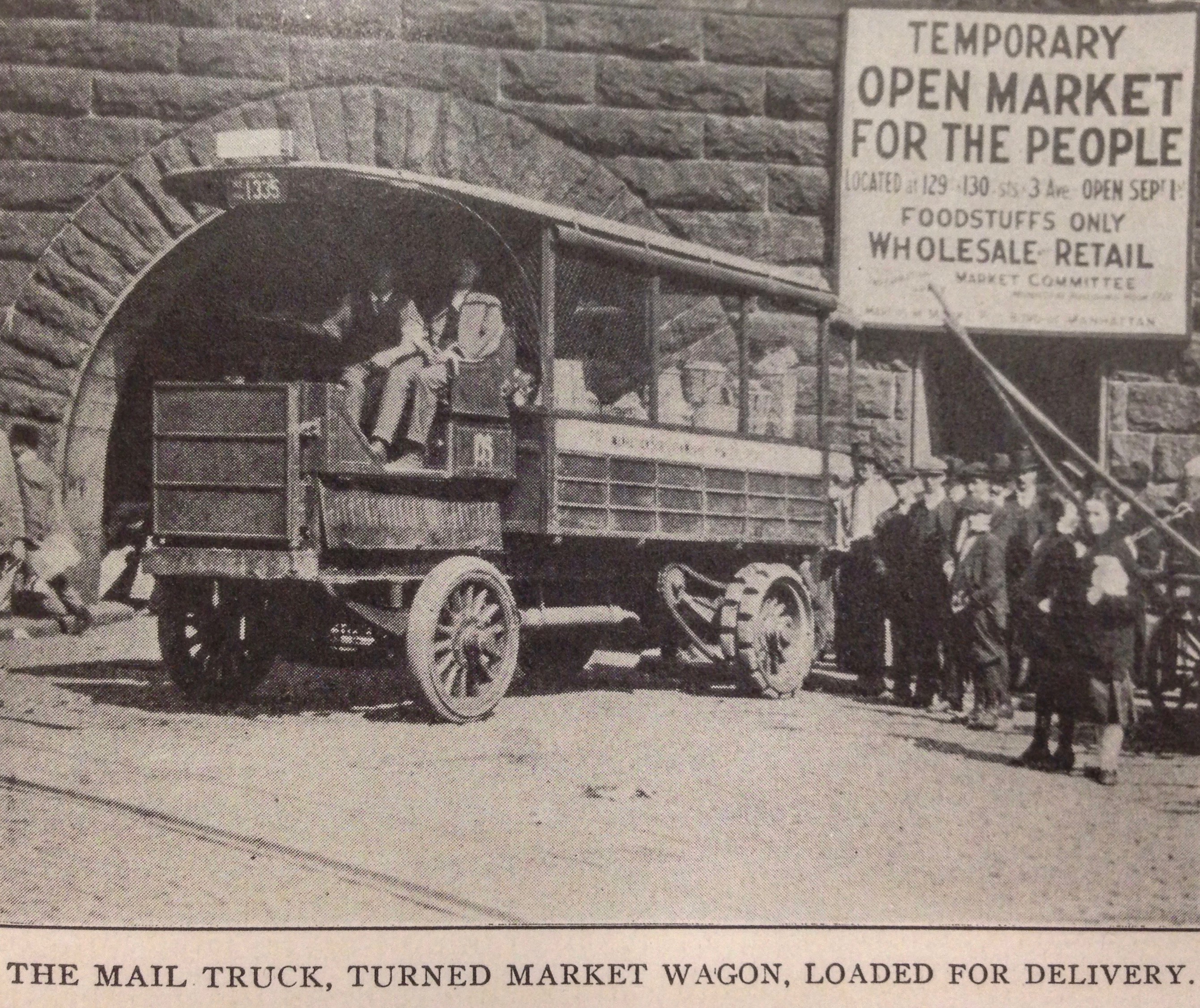 A mail truck transformed into a market wagon carrying food