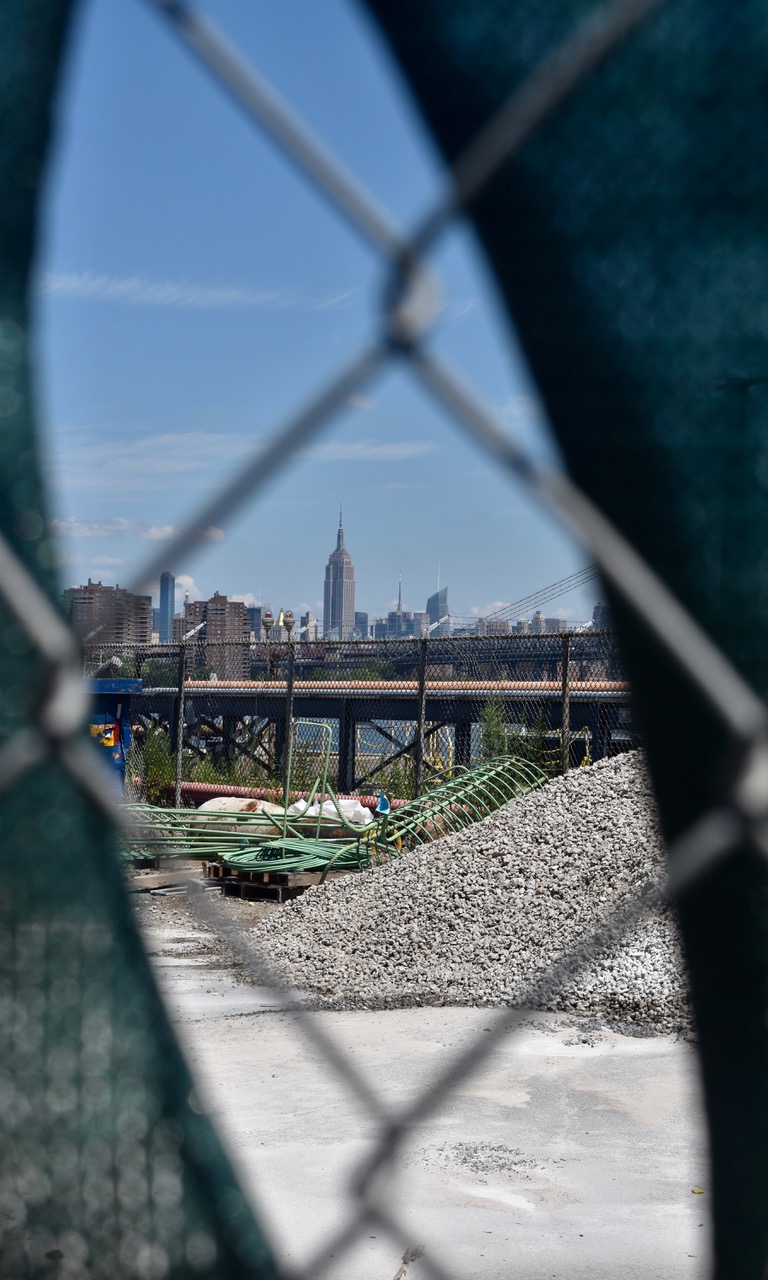 Manhattan skyline seen through fence