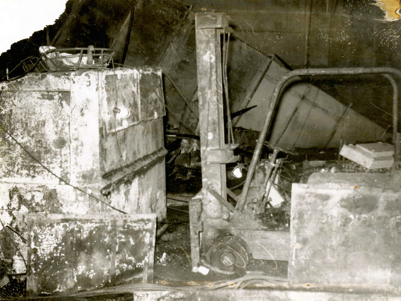 Charred forklift and trash can, the source of the Constellation fire. Michael DeLucia Collection, Brooklyn Navy Yard Archive.