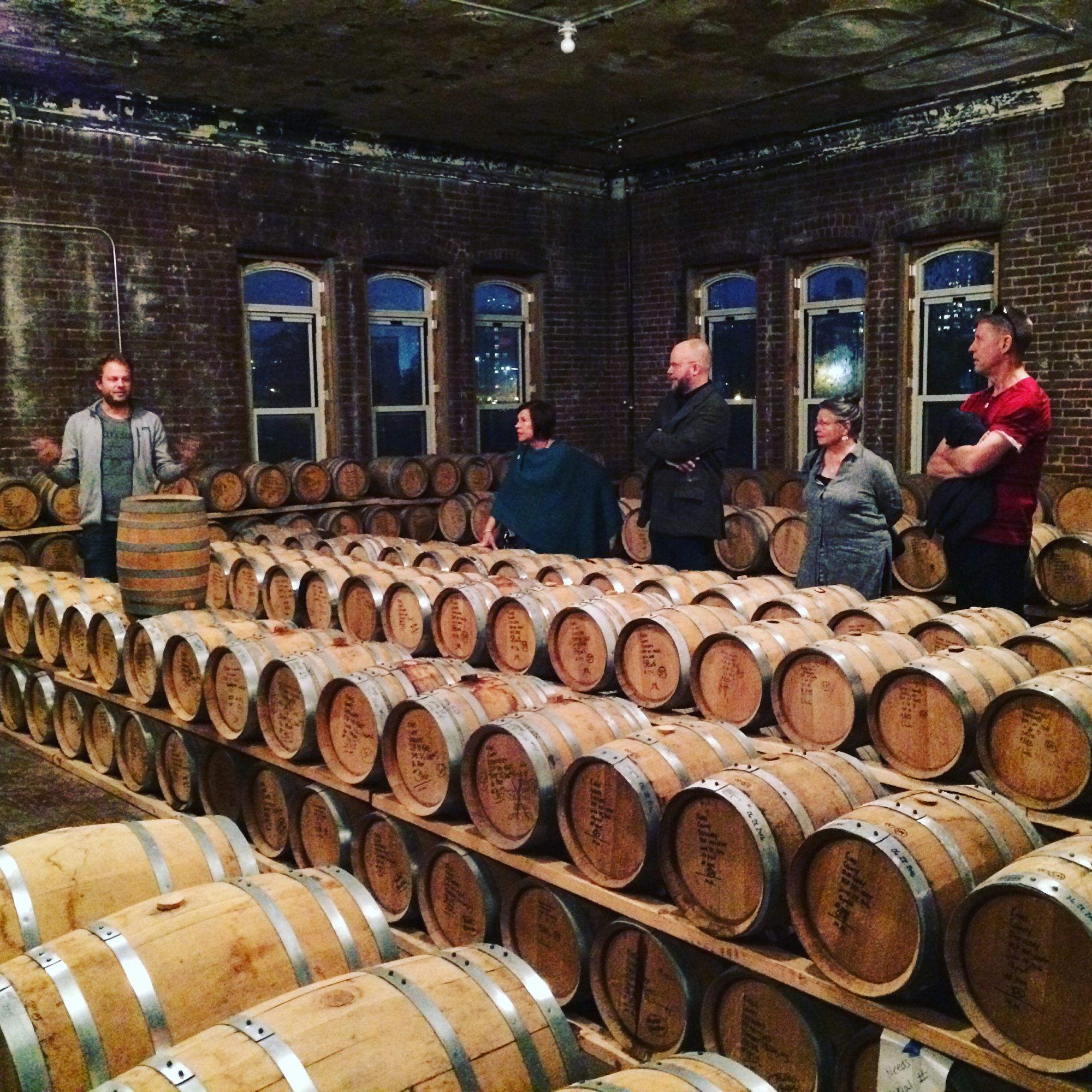 Colin leading a tour in Kings County Distillery barrel room