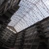 A dramatic look up at the window frames that connect two sides of the Brooklyn Army Terminal's gigantic and imposing Building B, made of poured concrete with off-set balconies