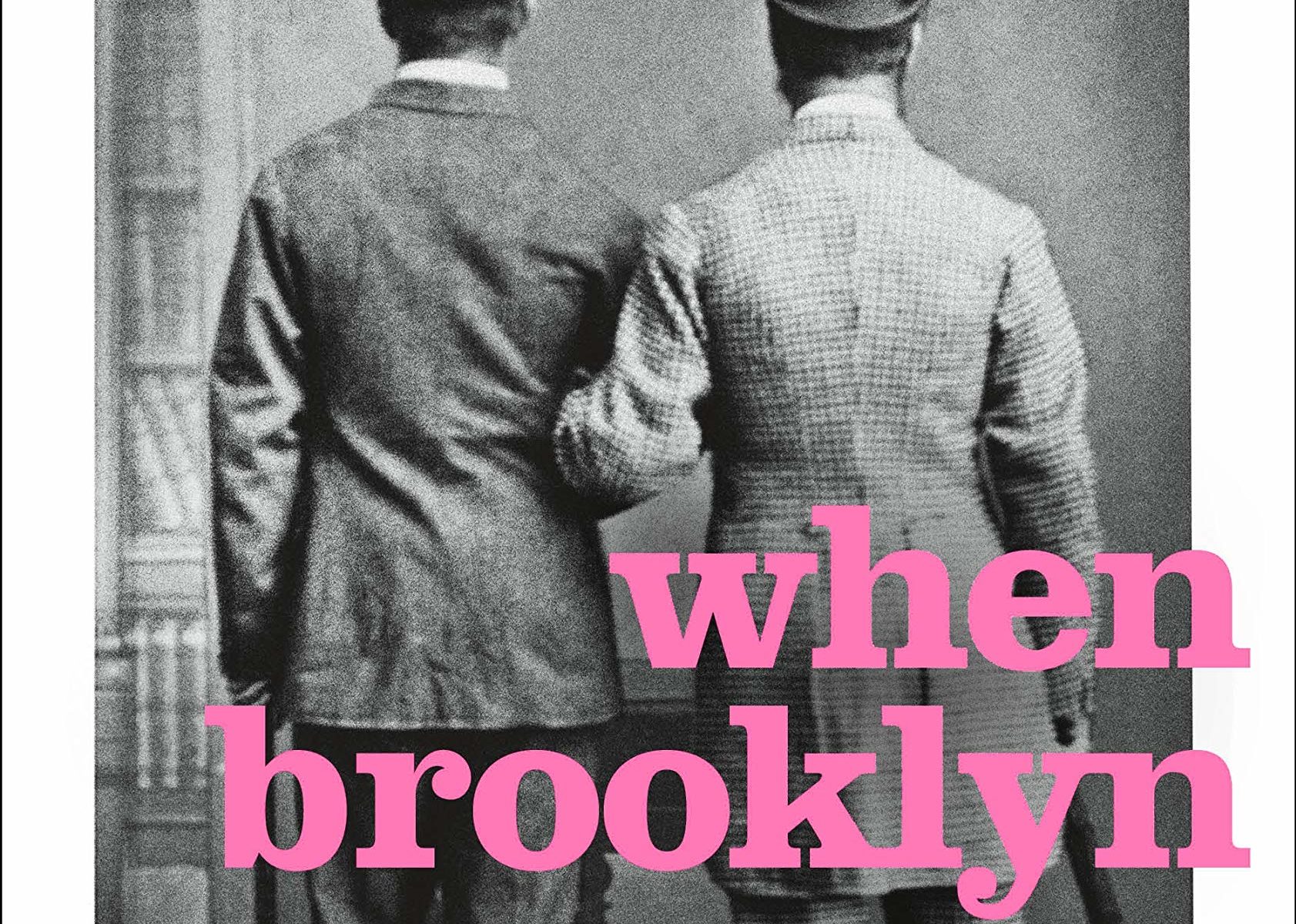 Black and white photo of two men turned away from the camera with linked arms with pink text overlay that reads, "When Brooklyn was Queer"