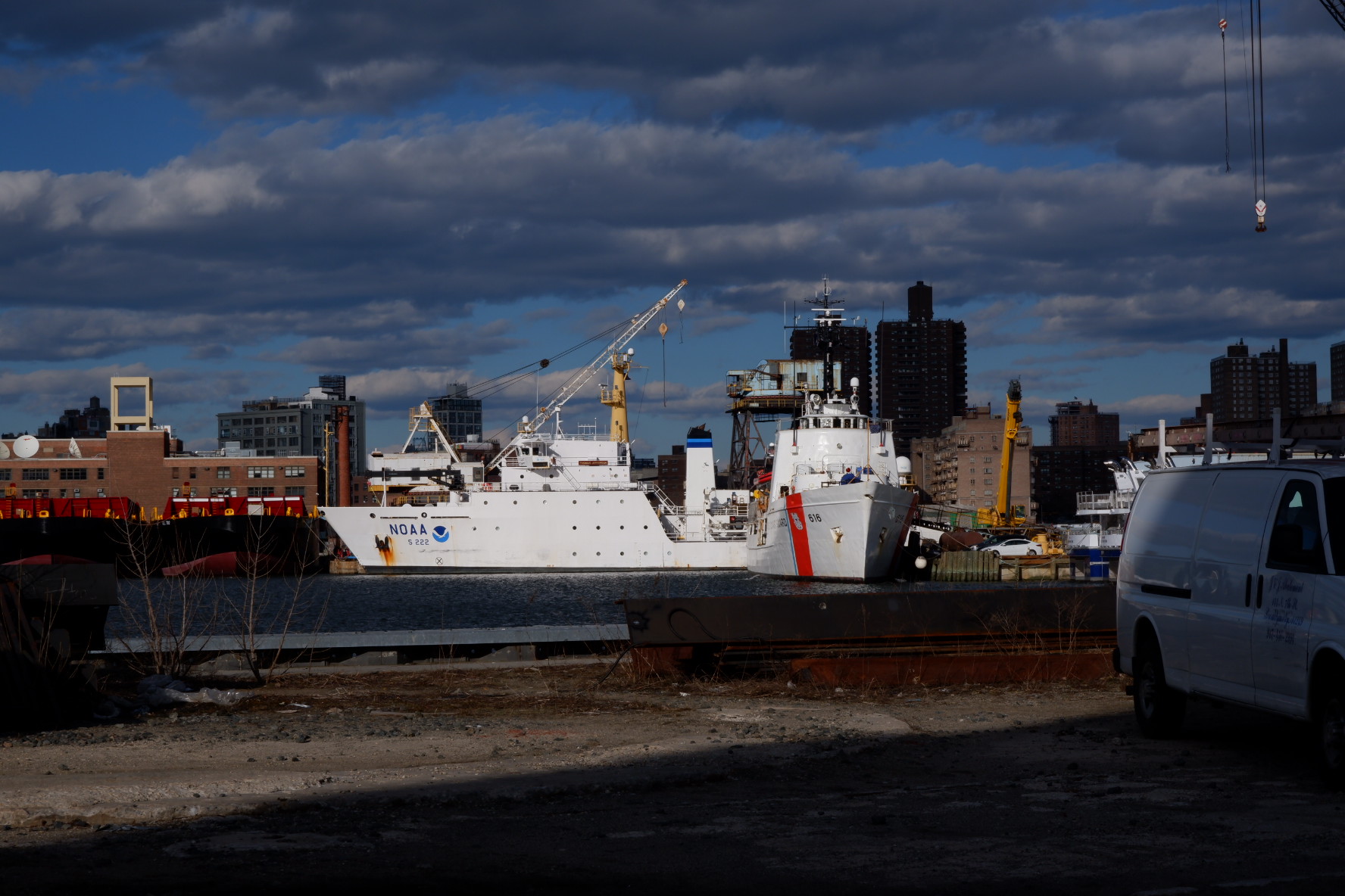 White NOAA survey ship and white US Coast Guard ship in Wallabout Bay