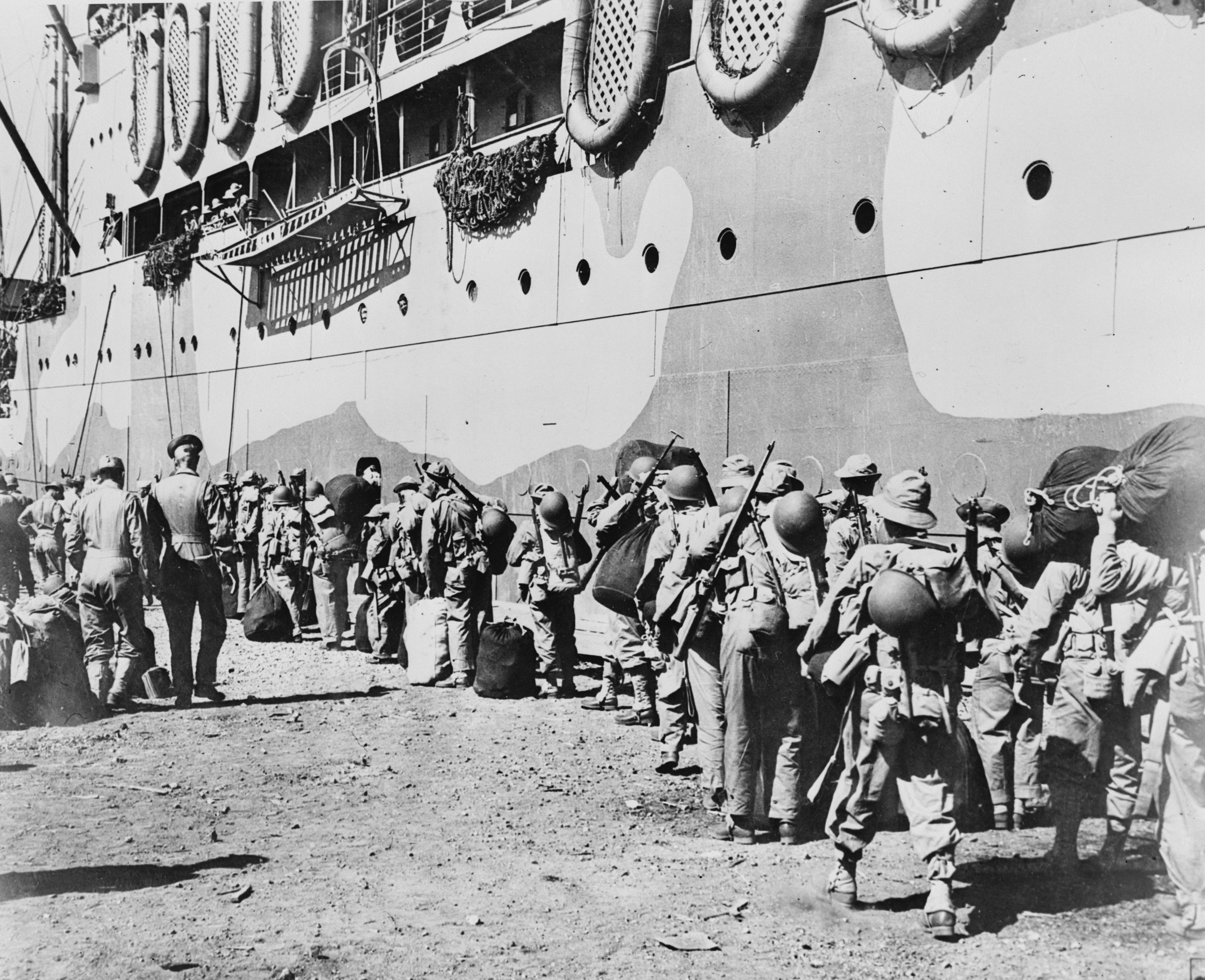 American troops boarding a transport which will take them from New Caledonia to the Solomon Islands battlefront