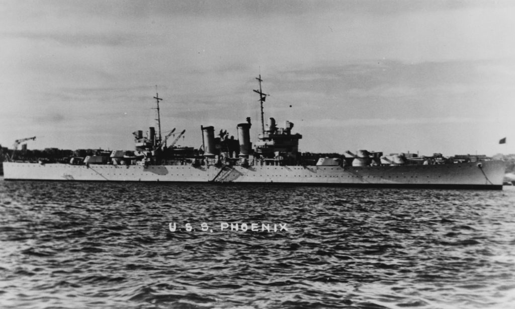 Black and white photo of cruiser USS Phoenix from the starboard side.
